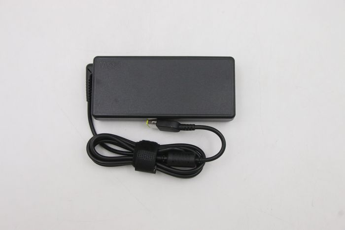 Lenovo 135W AC adapter charger for Lenovo devices, input 100-240VAC, slim-tip connector, energy efficient, portable design.